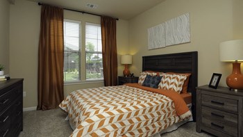 Carpeted Bedroom With Large Double Windows